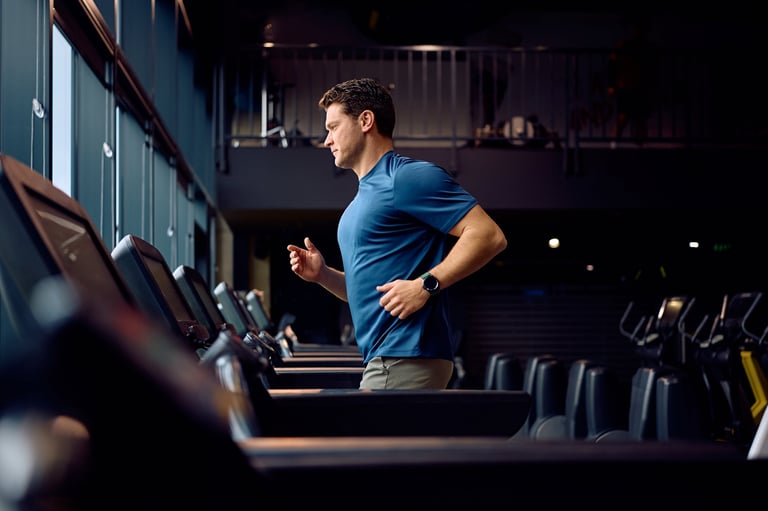 Athlete training on running track at modern fitness center