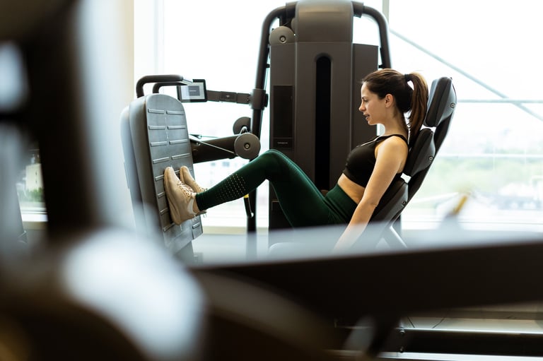 Dedicated athlete engaging in leg press exercise showcasing determination and strength in gym