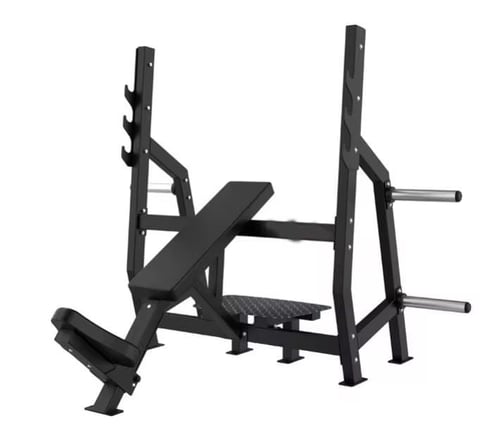 Black metal weight bench with barbell rack and leg extension attachment on white background
