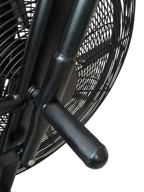 Close-up of black electric fan showing metal frame, mesh grille, and textured handle grip against white background
