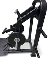 Black leg press machine with weight plate