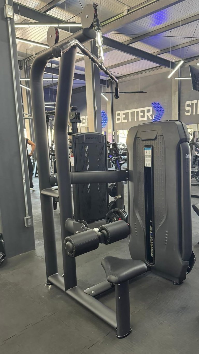 Lat pulldown machine in modern gym
