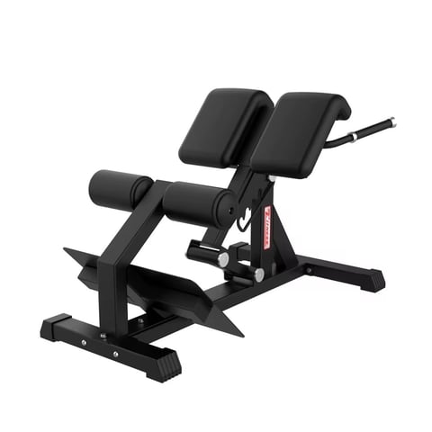 Black weight training bench with adjustable backrest, leg extension attachment, and foot platform for strength exercises