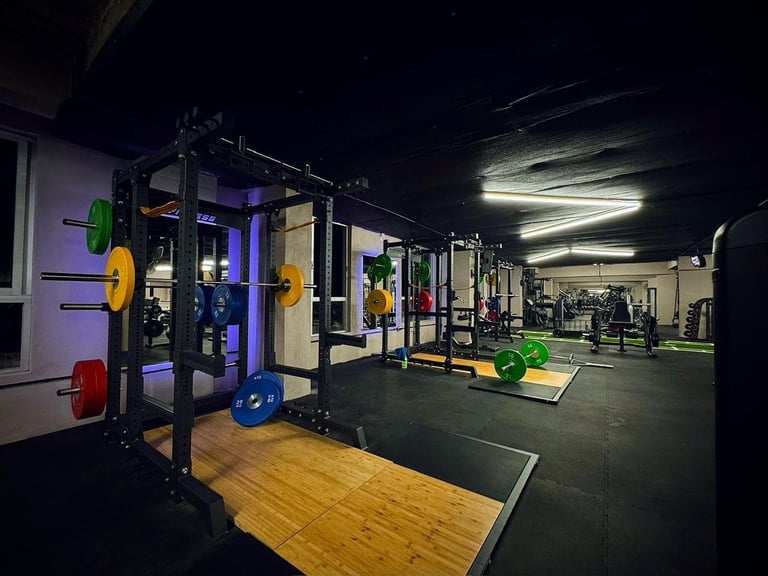 Modern gym interior with weight lifting station and equipment racks