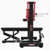 Red and black leg press machine with adjustable bench and weight plate apparatus on white background