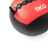 Red and black 5kg medicine ball with rope handles and textured grip on white background